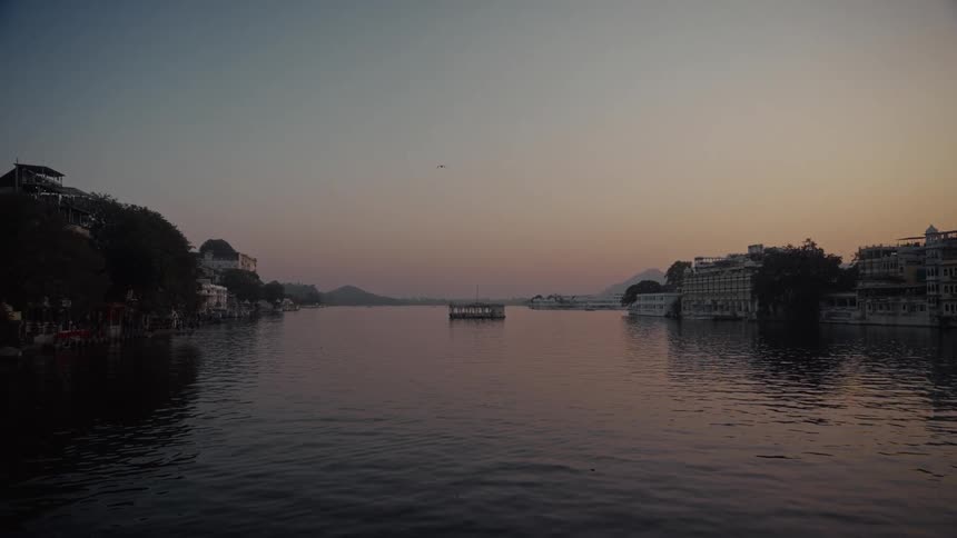 A view of the sun setting over a river