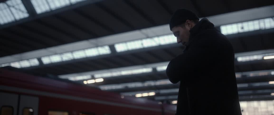 A man is standing in a station