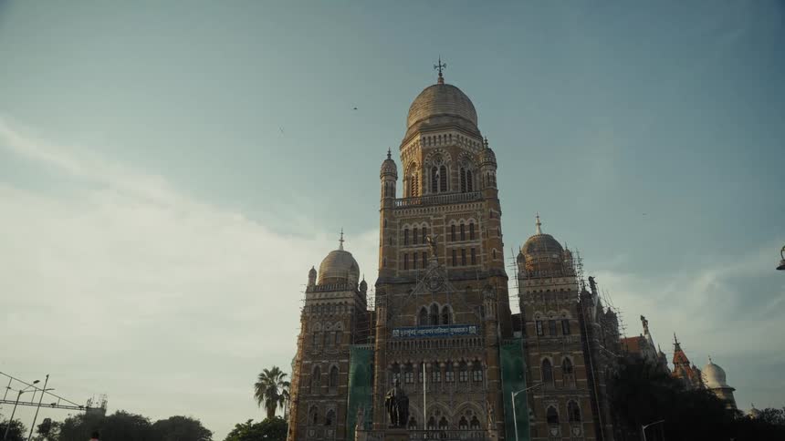 Historic building with grand architecture and detailed domes under a clear sky