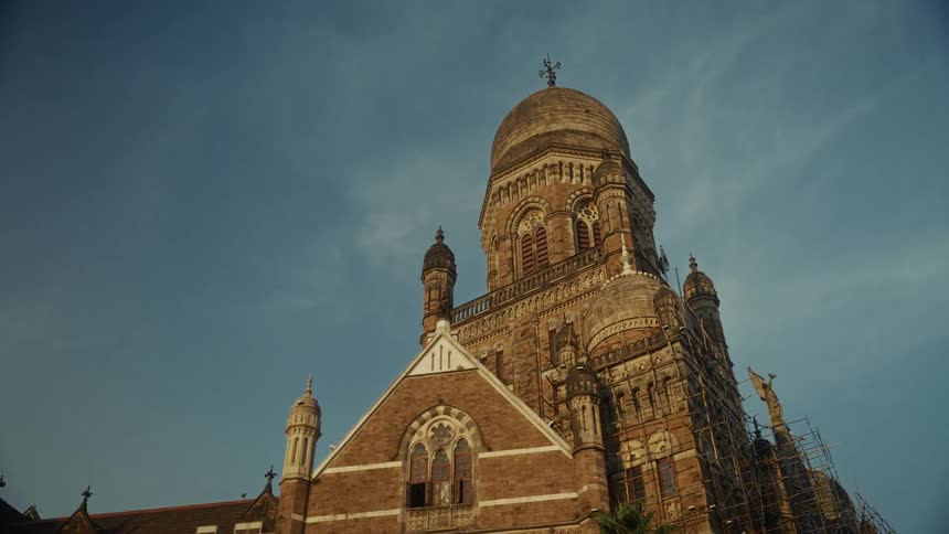 Birds fly around the dome on the church