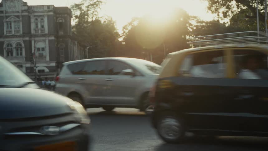 Pedestrians walk past the busy intersection