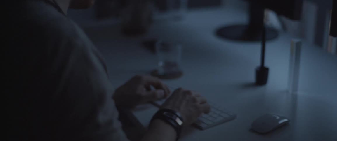 A man types on a keyboard