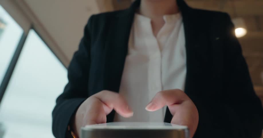 A woman using a smartphone in a room