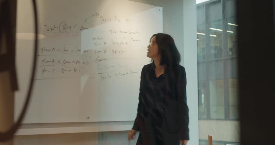 The woman is giving a lecture in the office