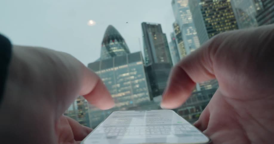 Close up of a person typing a message on their smart phone