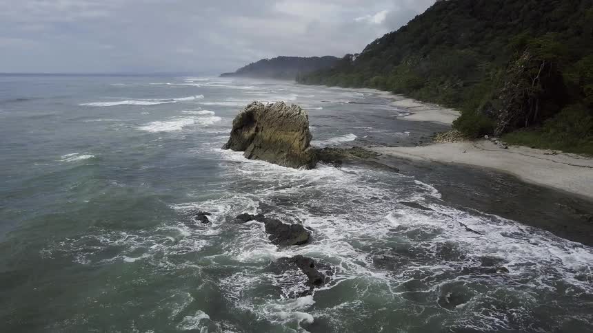 Waves crash against the shore