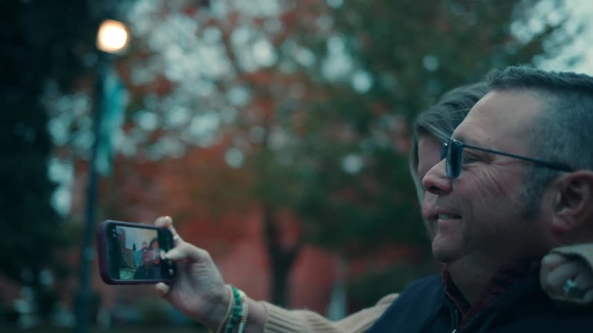 A man and woman taking a selfie