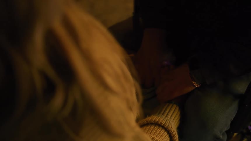 The man and woman are holding hands