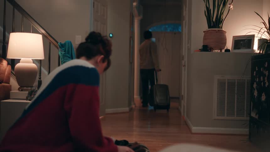 A couple are leaving the home with luggage