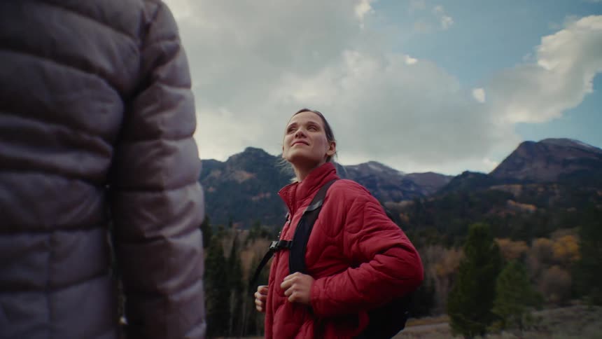 People observing the mountain landscape during a hike