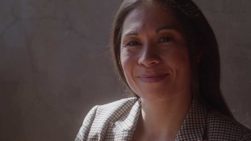 Sun shines on the woman smiling inside