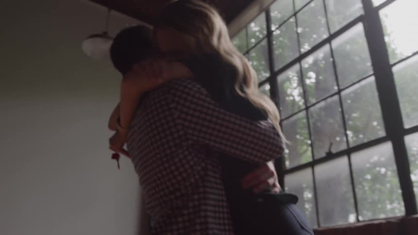 A man and woman hugging each other