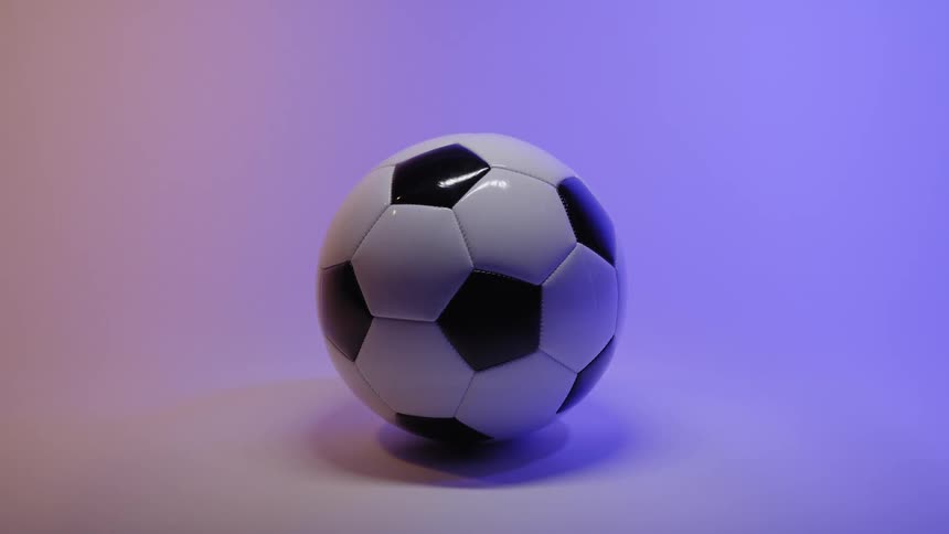 A soccer ball against a colorful background