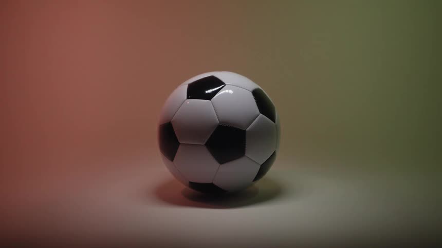 Lights in the studio reflect on the soccer ball