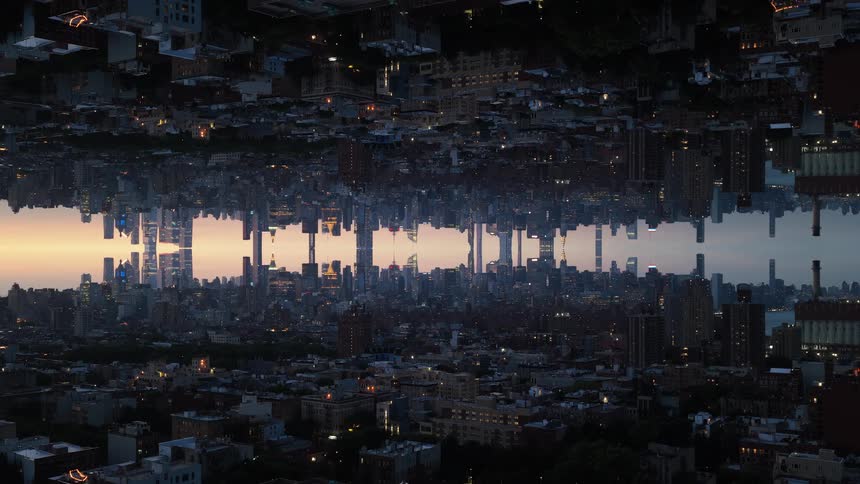 This video shows a cityscape that is vertically mirrored creating a unique and disorienting visual effectthe two halves of the city meet in the middle appearing as if the skyline is reflected in a colossal central mirror with the colors of the suns