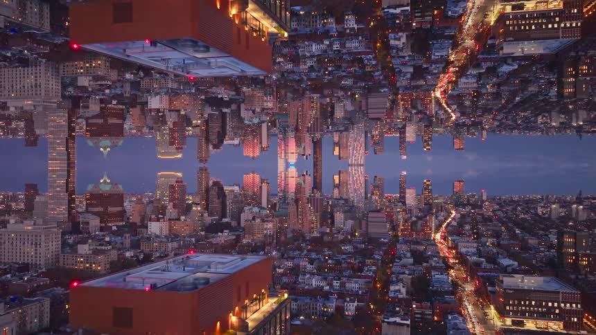 A view of a city mirrored at night