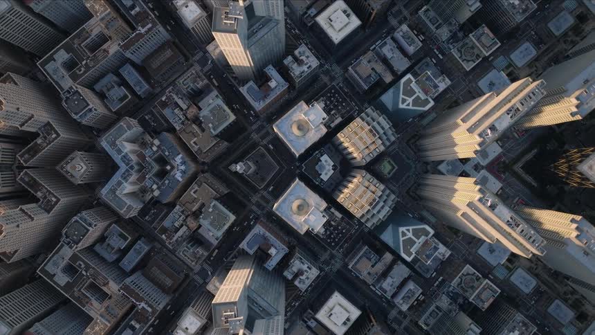 Aerial of downtown blocks spreads from the center creating duplicate buildings in each half