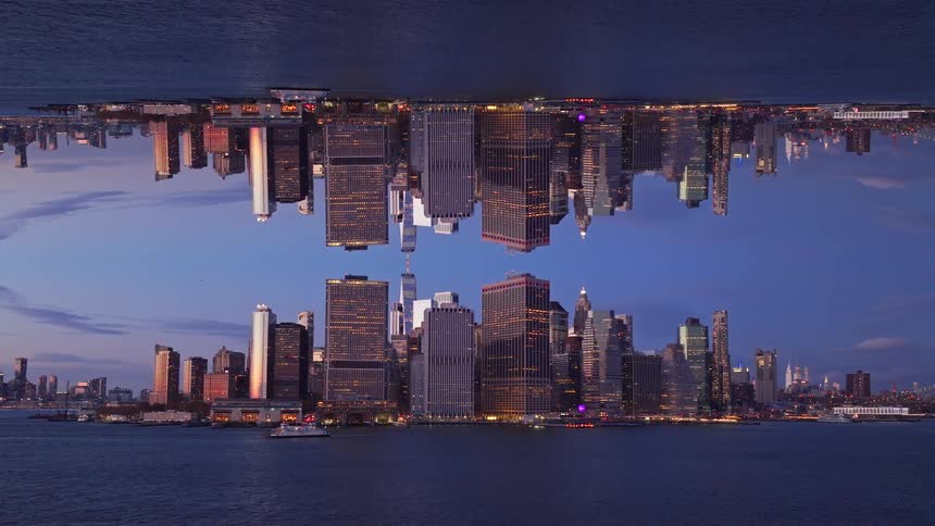A mirror image of a city at dusk