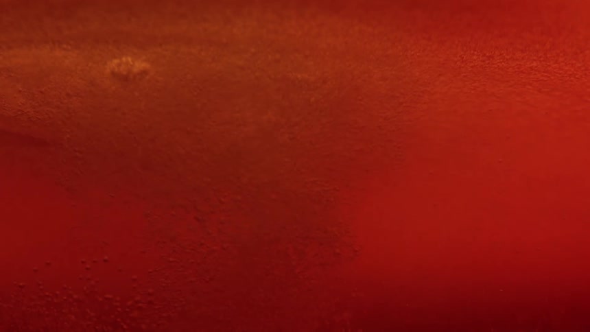 Abstract redtoned texture with variations of light and shadow
