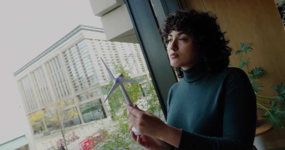 A woman looking at designs in an office