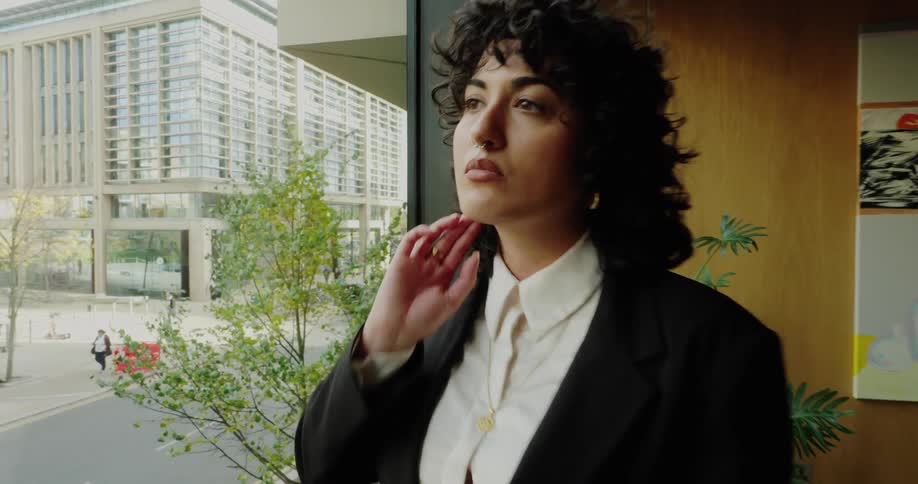 A woman standing in an office at work