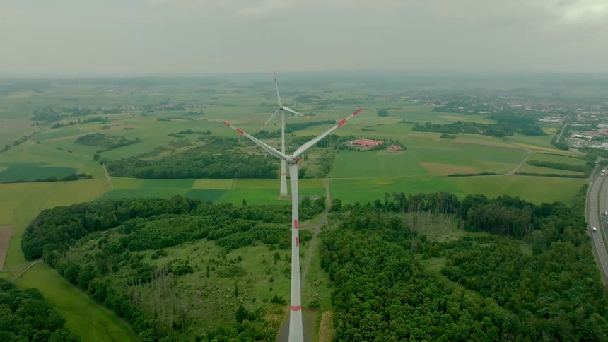 Turbines stand tall above the land