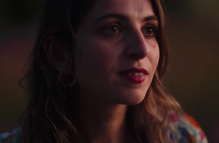 Closeup of a woman looking toward the horizon in soft light
