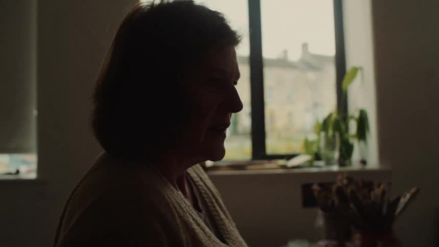 Woman focused on an indoor environment