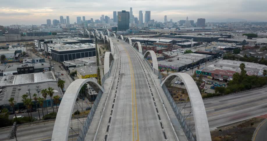An aerial view of Los Angeles with traffic on the Sixth Street Viaduct bridge