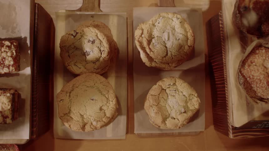Close up of various cookies and desserts arranged on a table