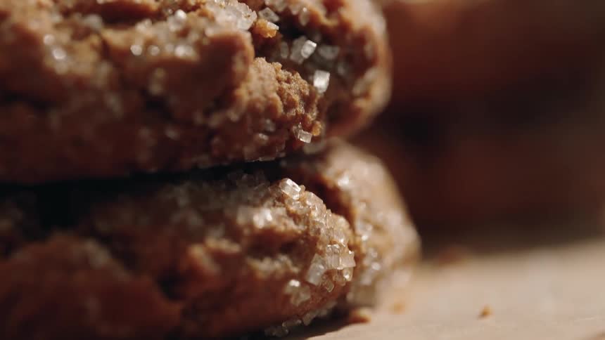 Close up of garnished stacked brown cookies