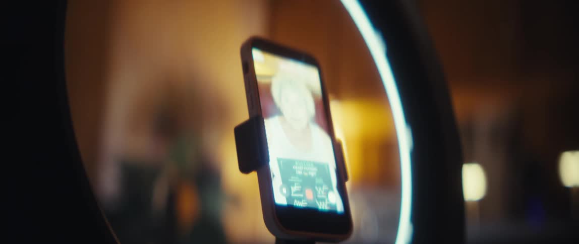 Person recording an elderly woman