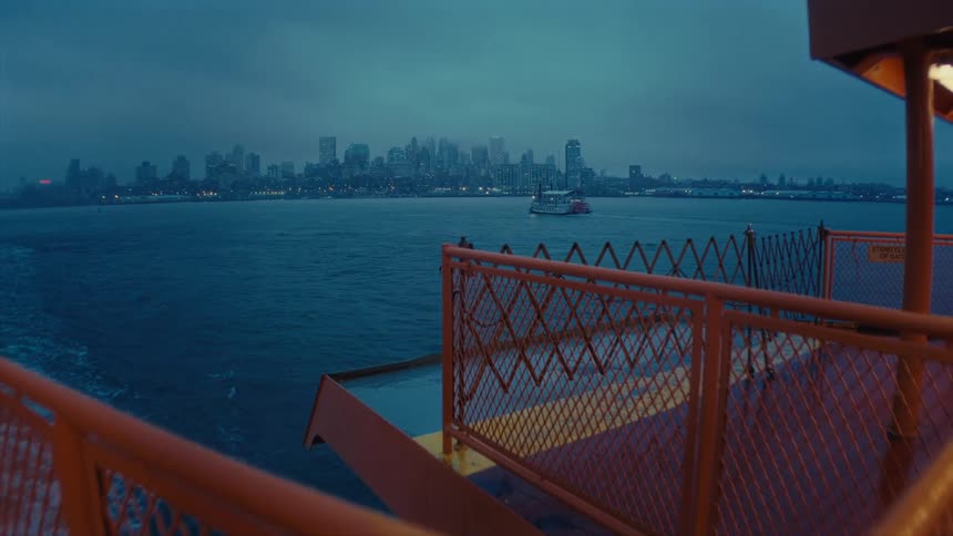 A boat is making its way down a river in a city