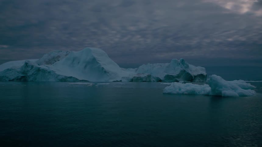 Icebergs and melting ice floating on the arctic water