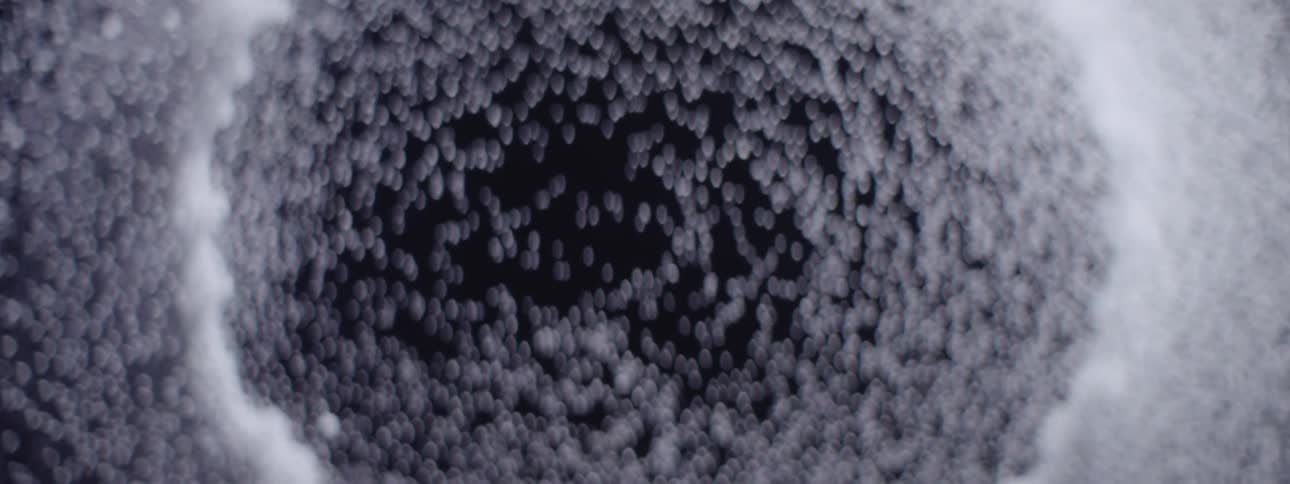 An animated series of white dots