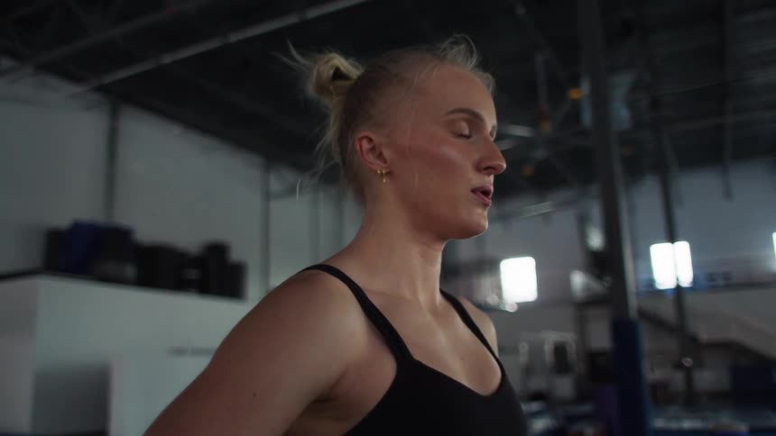 Woman in a sports facility wearing workout attire