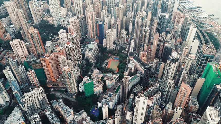 Drone Flying Over a Dense Business Area in Large City