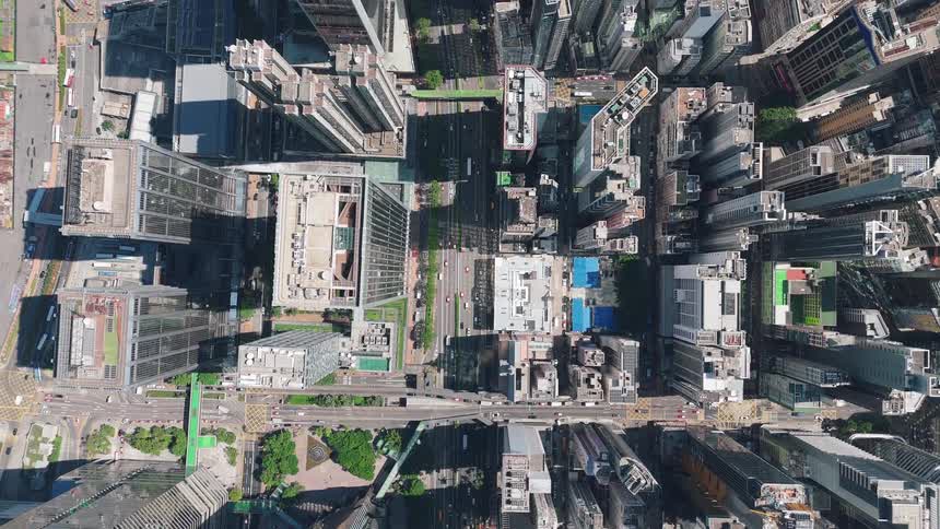 Buildings and streets with traffic in a metropolitan area outdoors during day time