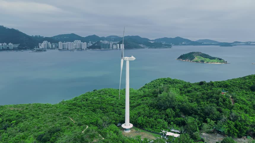 Wind turbine installed in a hilly area near the sea