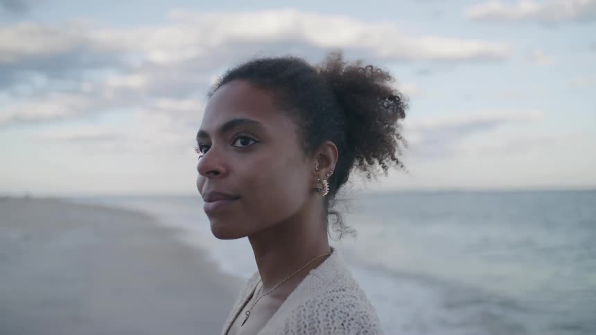 A portrait of a woman on a beach