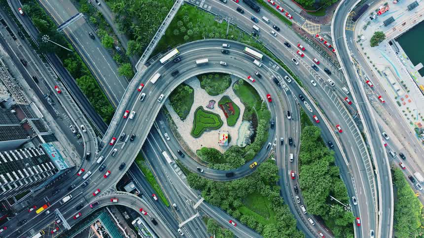 Traffic runs on the twisting roads of the freeway