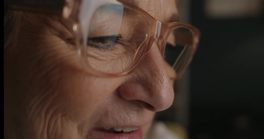 Closeup of a face with glasses focused on the eye and cheek area