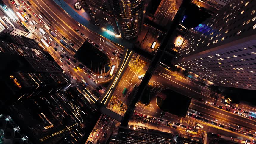 Aerial of a lit highway system in a metropolitan city at night