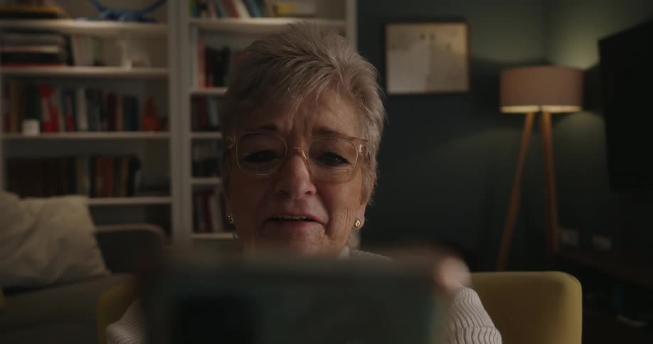 The woman laughs while talking on her phone