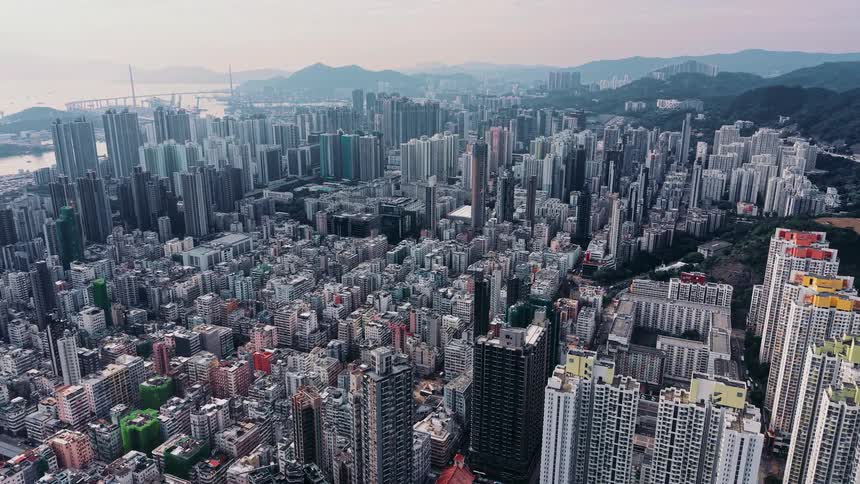 A very large city is on the waterfront and near mountains
