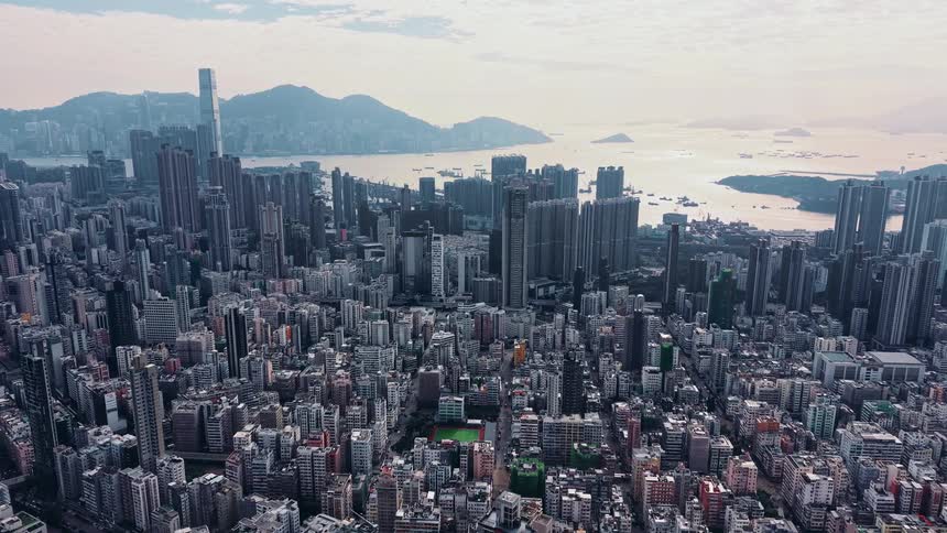 Aerial view of a dense urban area with skyscrapers near the coastline