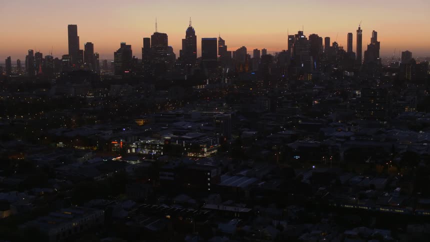 Aerial view of a city at sunset