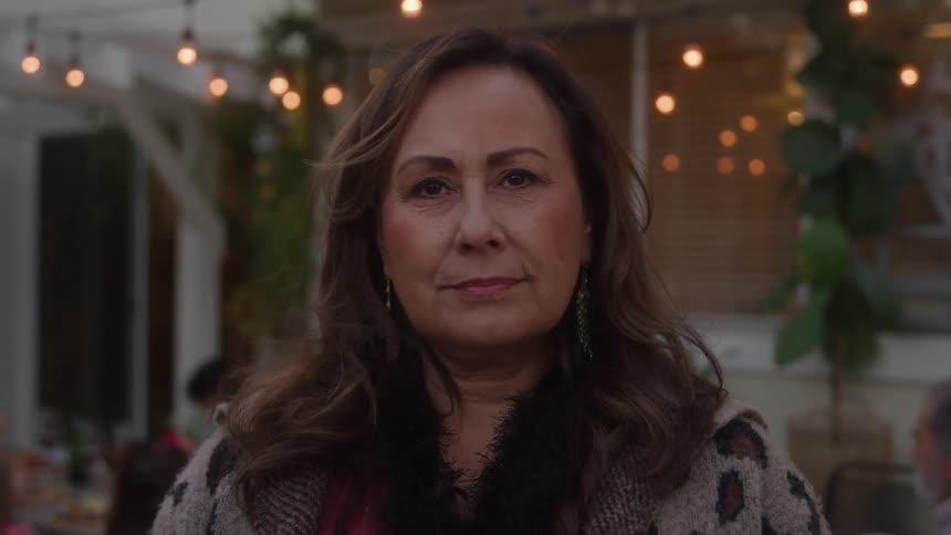 A portrait of a woman standing outdoors