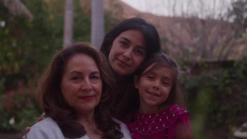 Three family members taking a portrait together