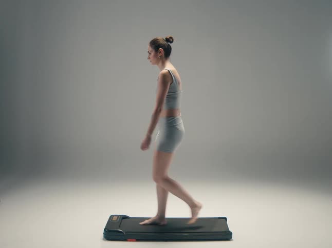 A woman walking on a treadmill
